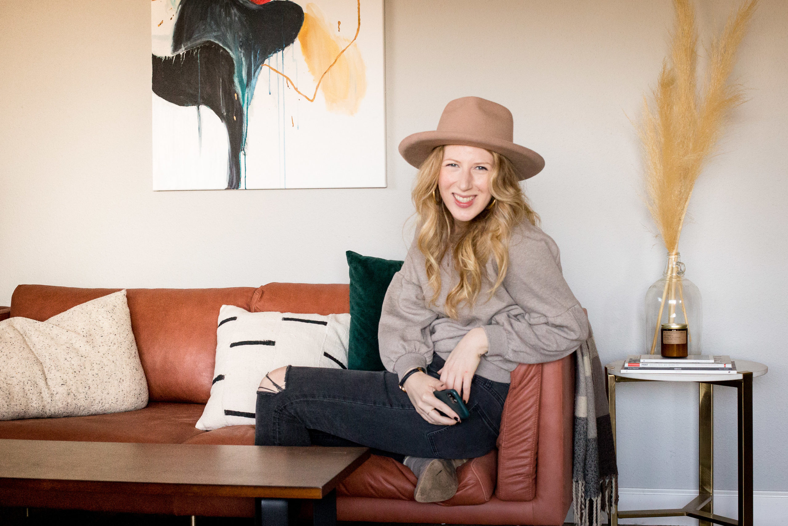 Web designer sits in her living room as she explains how she can create and evolve