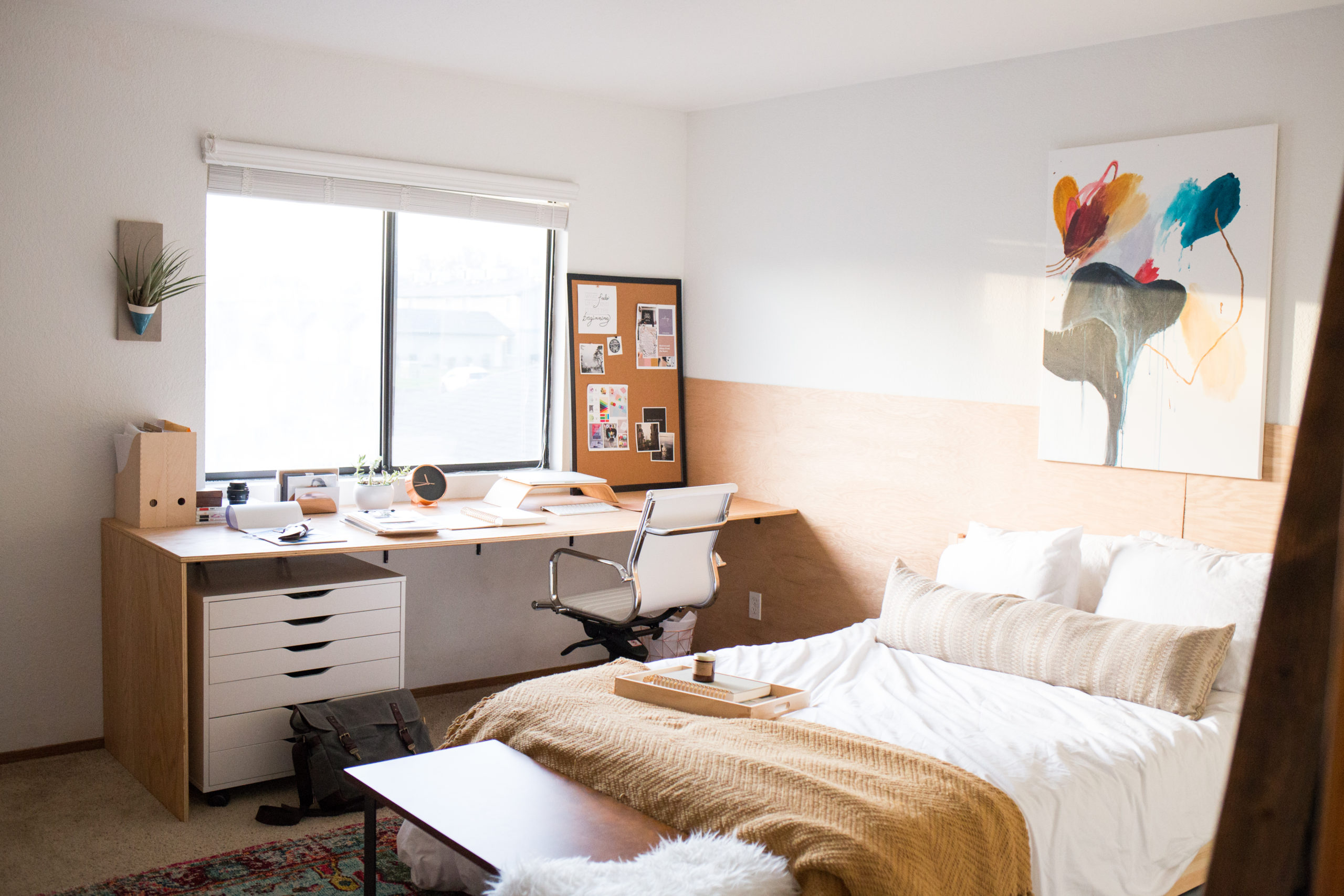 A photo of a bedroom turned into a creative studio and productive home office